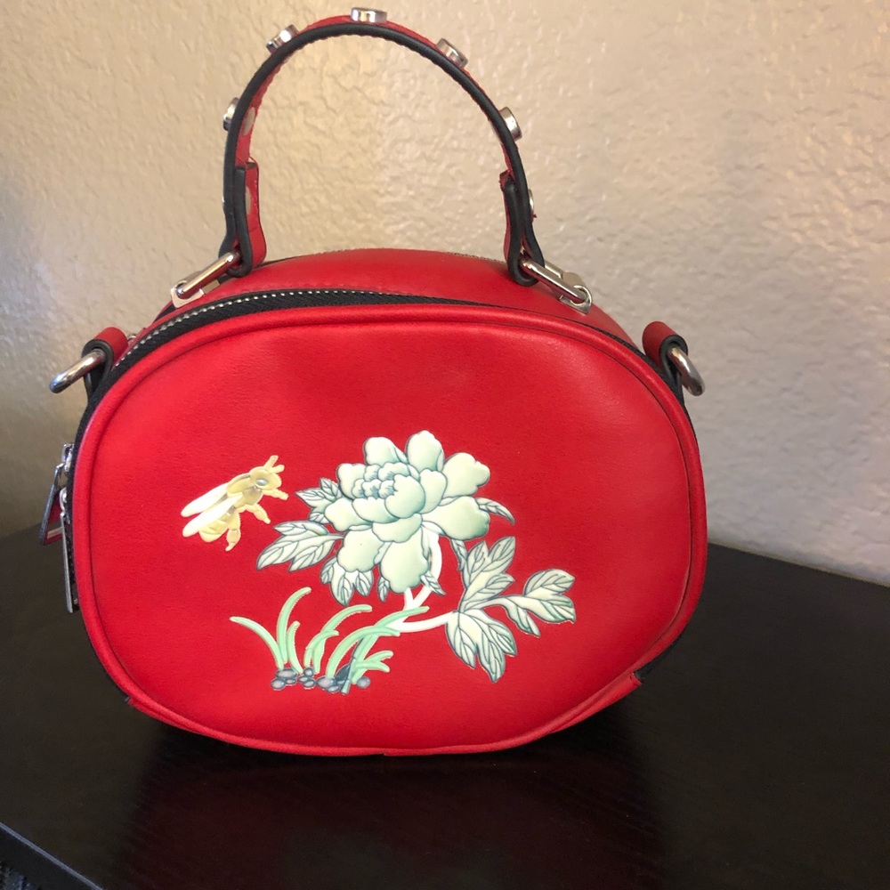 Red floral purse. No brand name. Adorable for a night out!